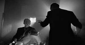 A film still from Citizen Kane that contains a lot of shadows with contrast.